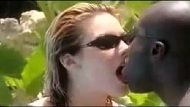 Hot interraical tongue kissing by the pool